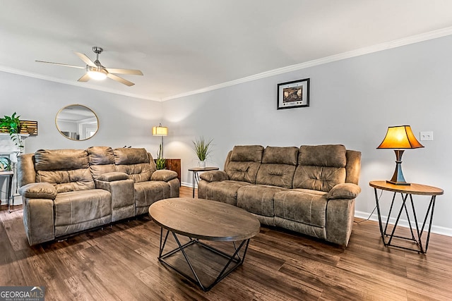 living room featuring crown molding, ceiling fan, and dark wood-type flooring