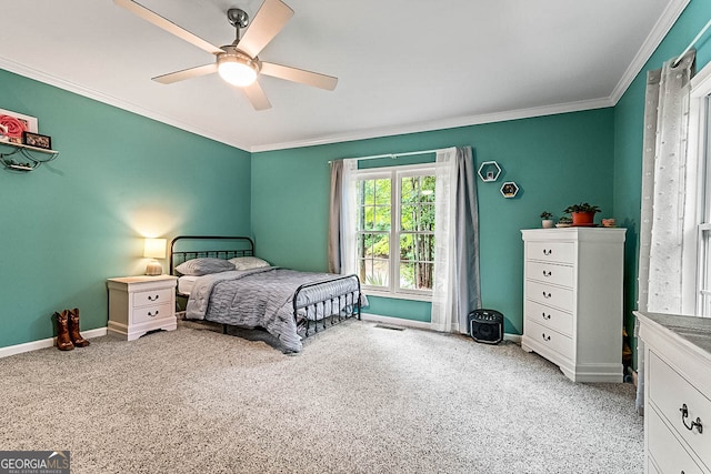 bedroom featuring crown molding, ceiling fan, and light colored carpet