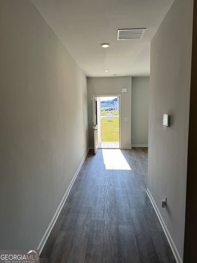 corridor with dark wood-type flooring