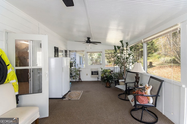 sunroom with ceiling fan, plenty of natural light, and heating unit