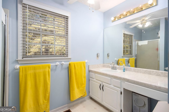 bathroom with vanity and a shower with door