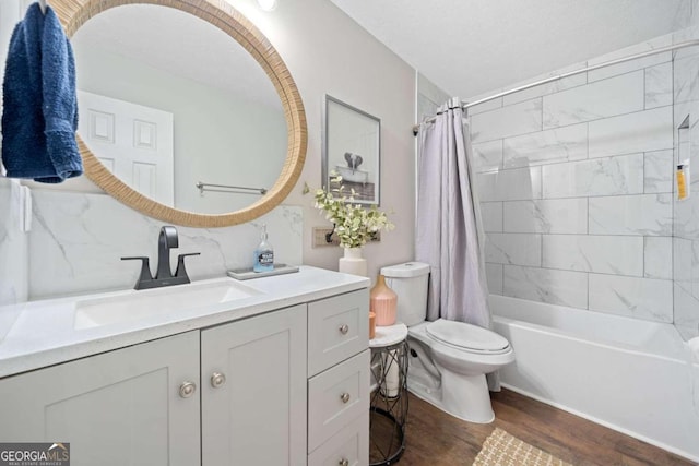 full bathroom featuring vanity, toilet, tasteful backsplash, shower / bath combo with shower curtain, and hardwood / wood-style floors