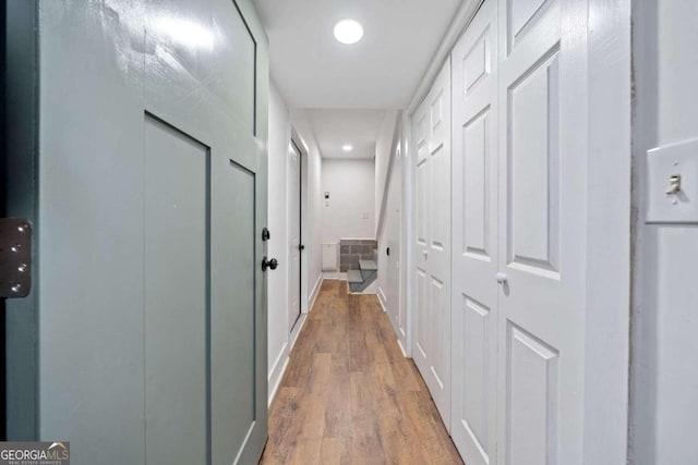 corridor with wood-type flooring