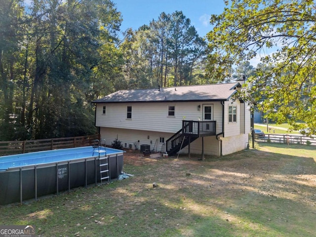 back of house featuring central AC