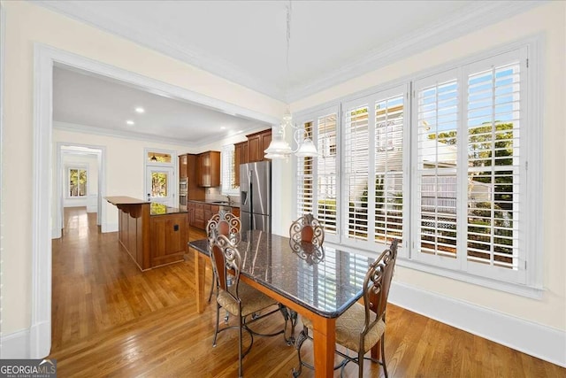 dining area featuring hardwood / wood-style flooring and a wealth of natural light