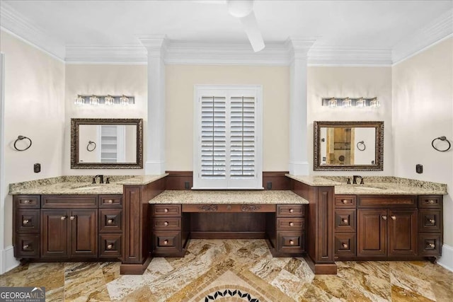 bathroom with ornamental molding and vanity