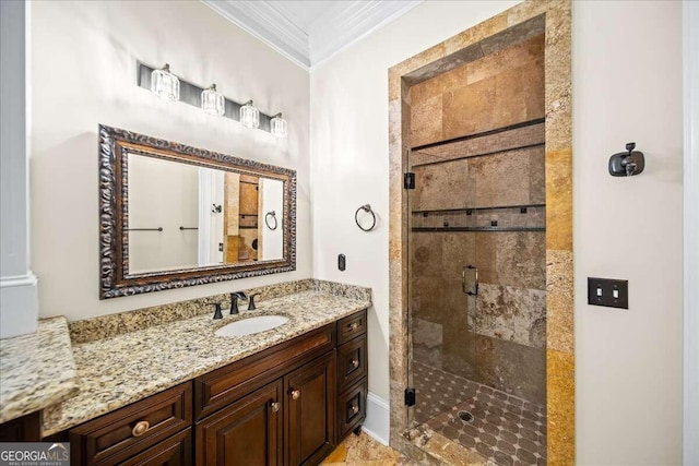 bathroom featuring an enclosed shower, crown molding, and vanity