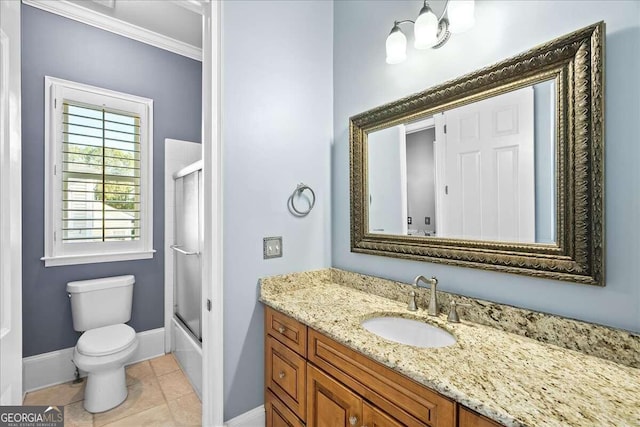 full bathroom with vanity, bath / shower combo with glass door, tile patterned floors, crown molding, and toilet