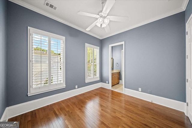 unfurnished bedroom featuring ceiling fan, light hardwood / wood-style flooring, connected bathroom, and crown molding