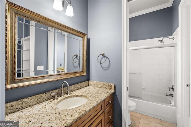 full bathroom featuring vanity, tile patterned floors, crown molding, toilet, and shower / tub combination