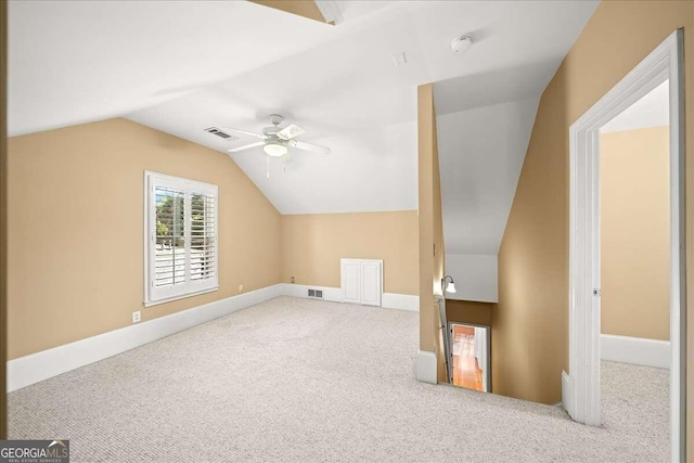 additional living space with lofted ceiling, ceiling fan, and carpet floors