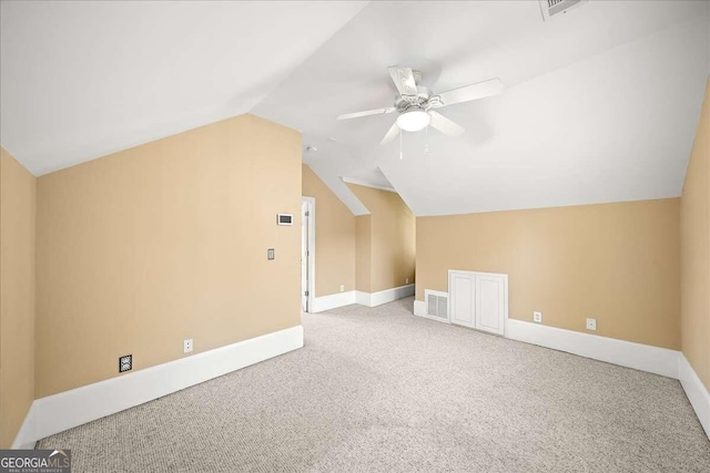 bonus room with lofted ceiling, ceiling fan, and carpet floors