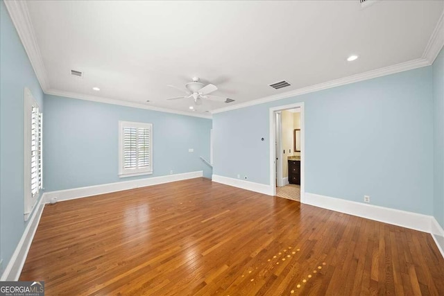 unfurnished room with wood-type flooring, ornamental molding, and ceiling fan