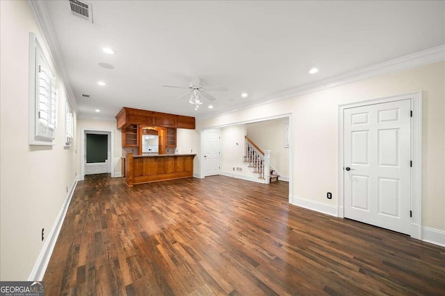 unfurnished living room with ceiling fan, crown molding, and dark hardwood / wood-style floors