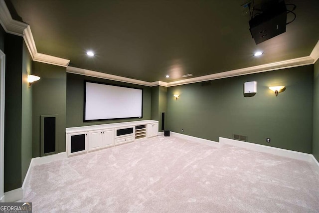 cinema with ornamental molding and light colored carpet