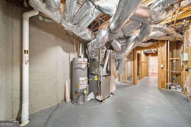 basement with water heater and heating unit