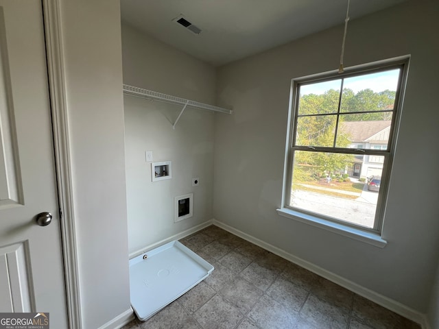 clothes washing area featuring hookup for a washing machine and electric dryer hookup