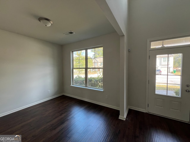 entryway with dark hardwood / wood-style floors