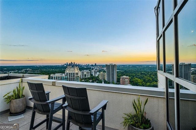 view of balcony at dusk