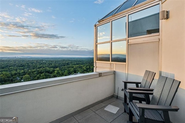 view of balcony at dusk