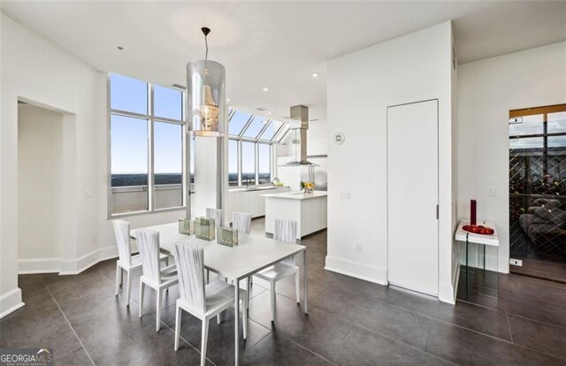 dining room featuring a water view