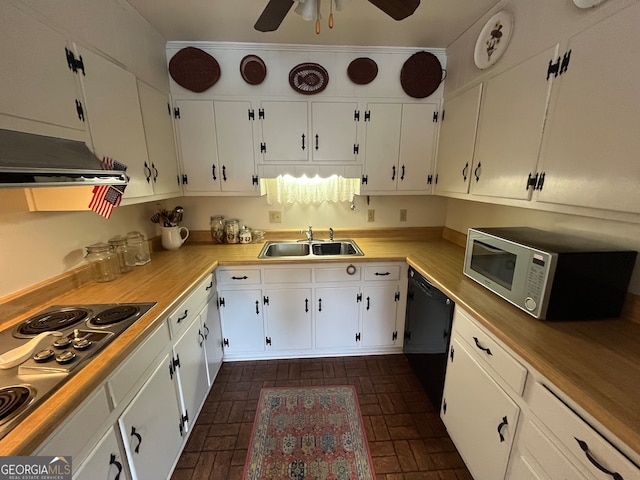 kitchen with dishwasher, electric stovetop, sink, and white cabinetry