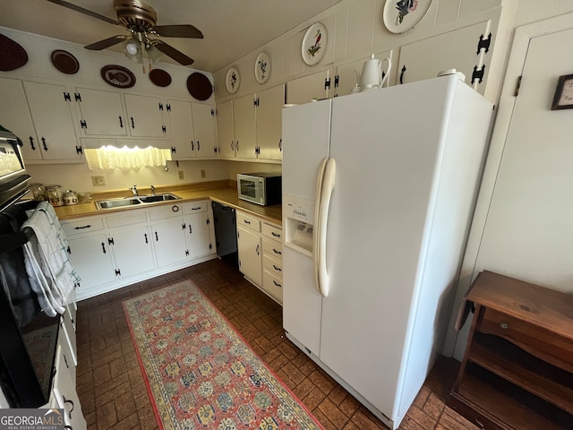 kitchen featuring ceiling fan, white cabinets, wall oven, sink, and white fridge with ice dispenser