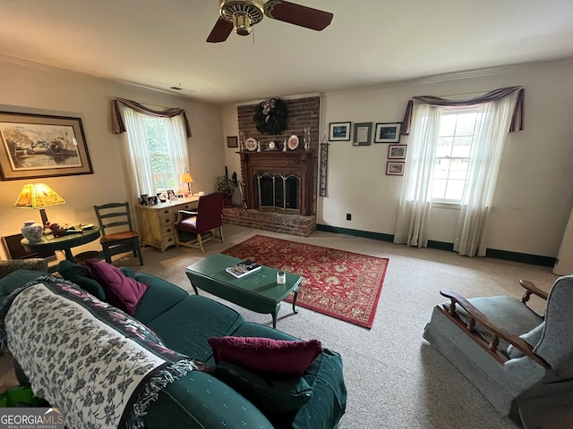 living room featuring ceiling fan, a fireplace, plenty of natural light, and carpet