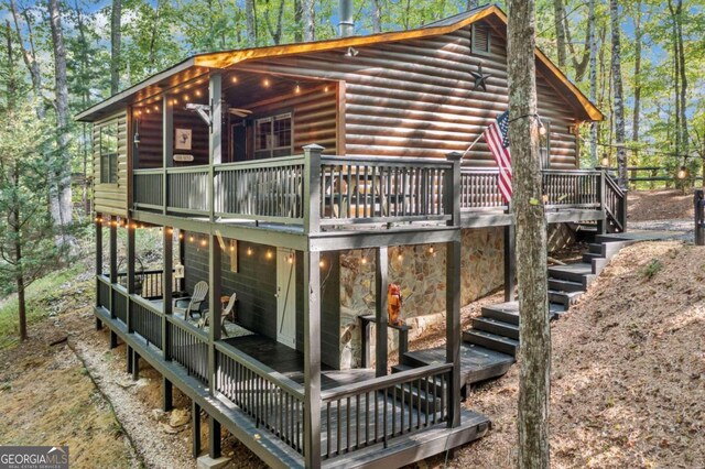 view of home's exterior with a wooden deck