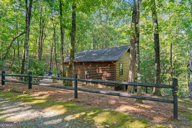 view of side of property with an outdoor structure