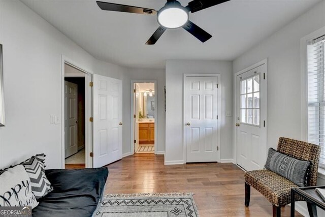 interior space with ceiling fan and hardwood / wood-style floors