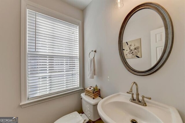 bathroom with sink and toilet