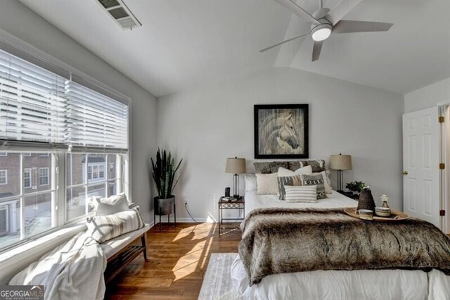 bedroom featuring lofted ceiling, ceiling fan, and hardwood / wood-style floors