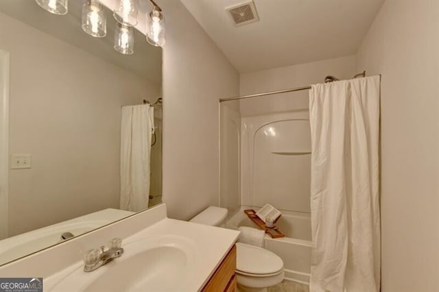 full bathroom featuring vanity, toilet, and shower / bath combo