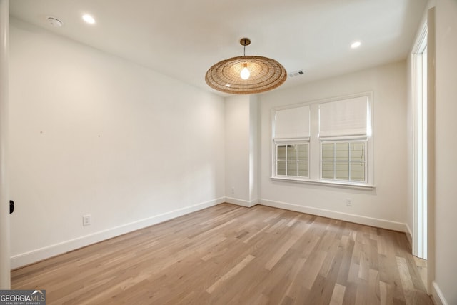 empty room with light hardwood / wood-style floors