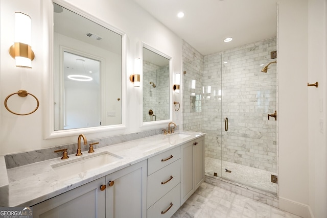 bathroom featuring vanity and a shower with shower door