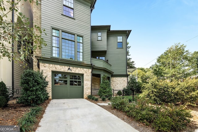 view of front of property with a garage