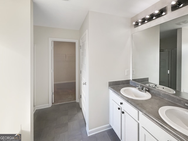 bathroom with an enclosed shower and vanity