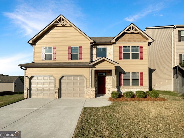 craftsman-style home featuring a garage and a front lawn