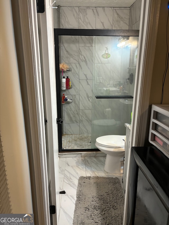 1126 Mainstreet Valley Dr, Stone Mountain, GA 30088 - bathroom featuring toilet and an enclosed shower