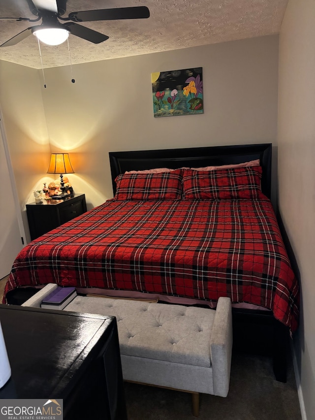 1126 Mainstreet Valley Dr, Stone Mountain, GA 30088 - carpeted bedroom with a textured ceiling and ceiling fan