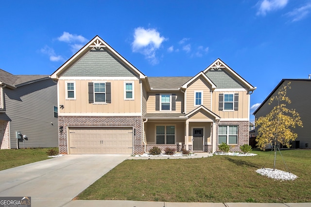 craftsman house with a front yard and a garage