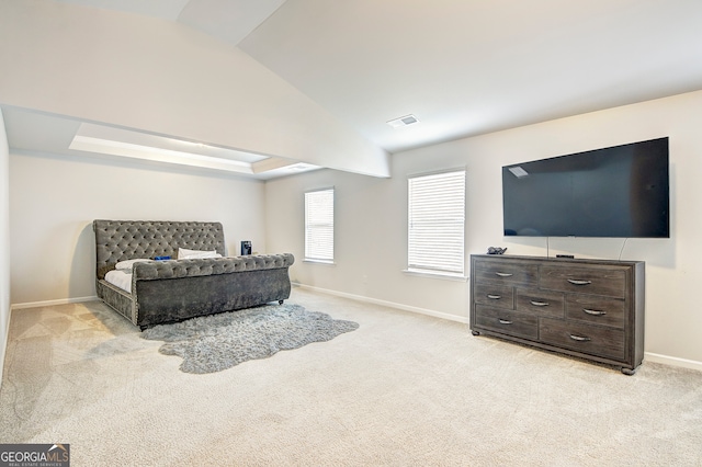 carpeted bedroom featuring lofted ceiling