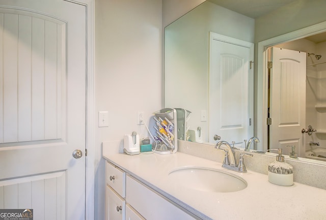 bathroom featuring shower / bathtub combination and vanity