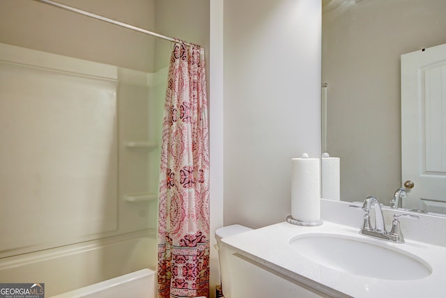 full bathroom featuring shower / bath combo, toilet, and vanity