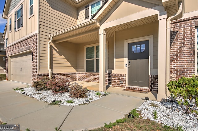 view of exterior entry with a garage