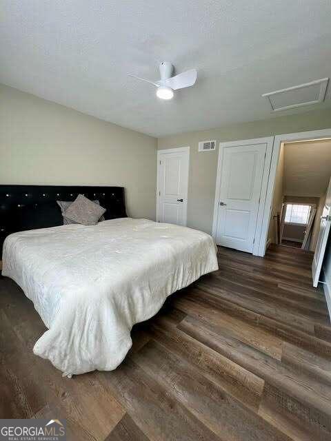 bedroom featuring dark wood-type flooring and ceiling fan