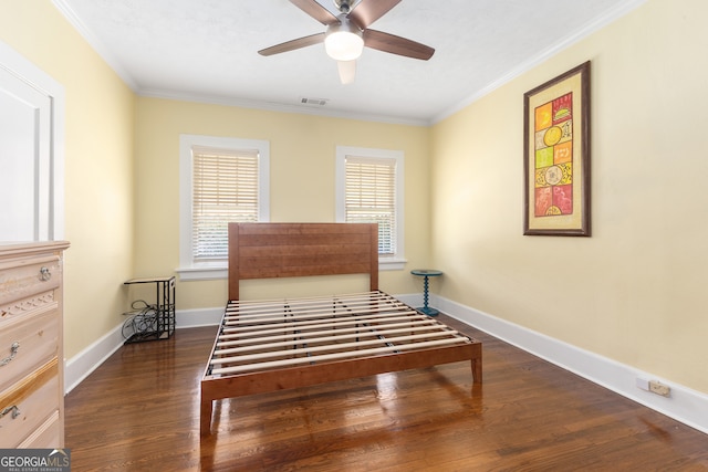 bedroom featuring ceiling fan, crown molding, and dark hardwood / wood-style flooring