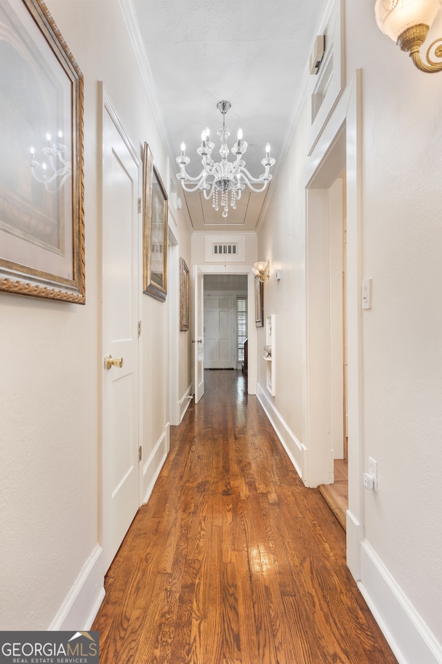 hallway featuring crown molding and dark hardwood / wood-style floors