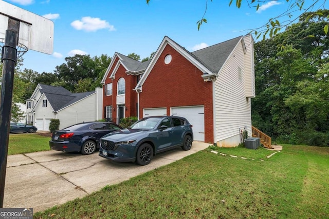 view of front of property with a garage and a front yard